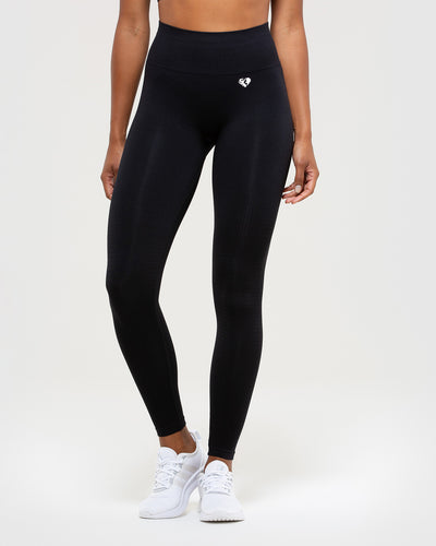 Top and Women's Sportswear Leggings in Black microfiber with push-up,  supportive, ribbed modeling effect, made in Italy.